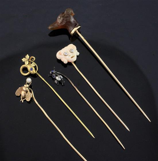 Five assorted early 20th century stick pins, largest 3.5in.